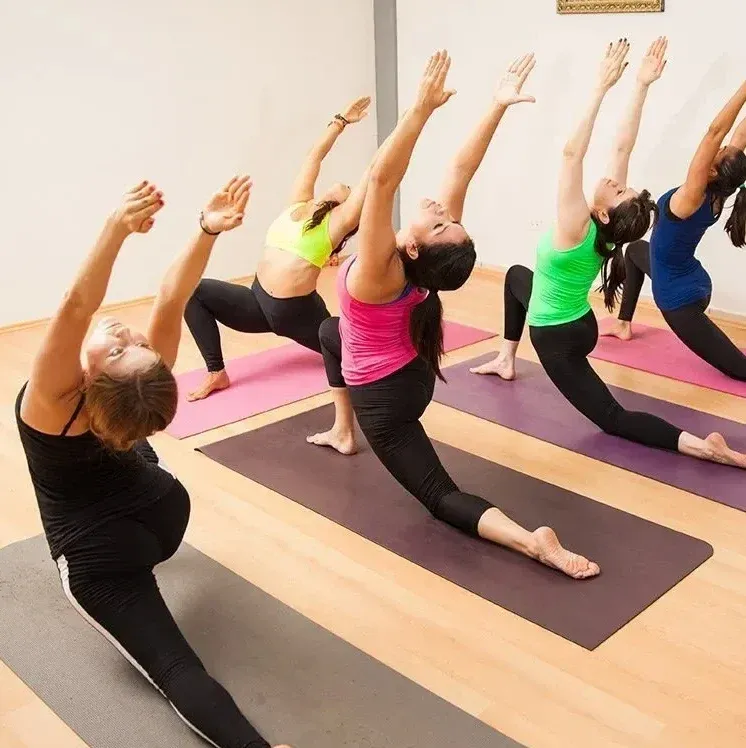 Students moving through a low lunge together