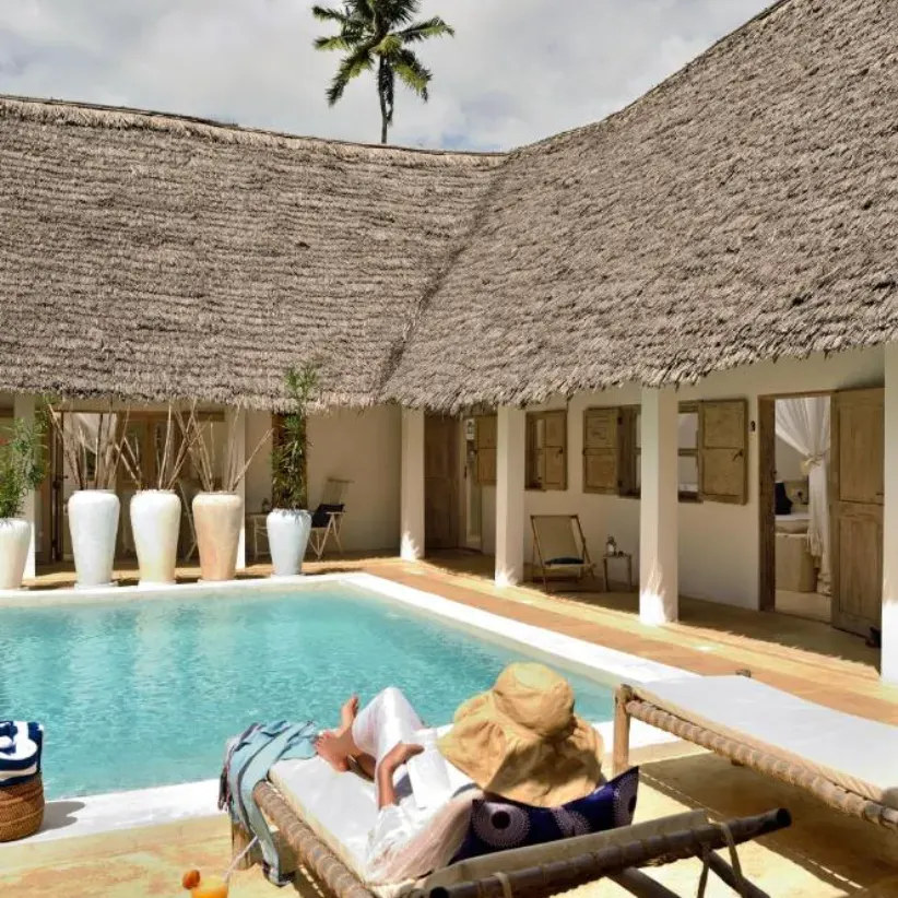 The pool and thatched villas at Sharazad in Zanzibar
